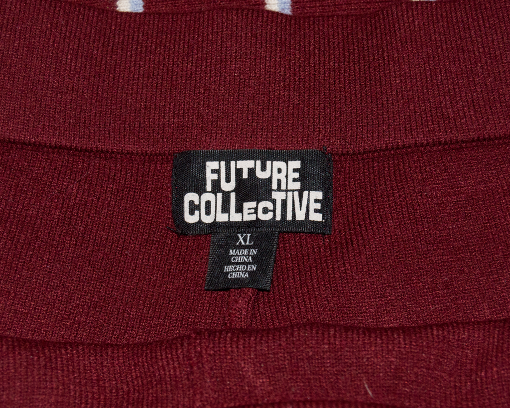 Close-up of a maroon fabric with a 'Future Collective' label.