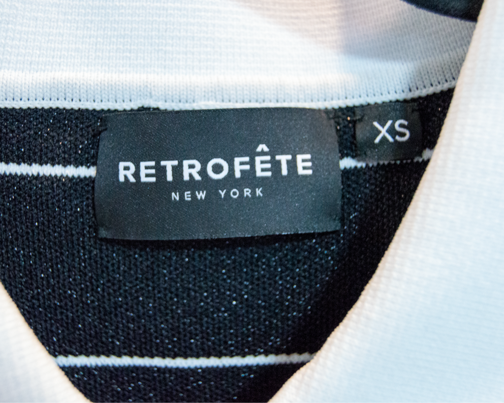 Retrofète New York label on a garment with black and white striped fabric.